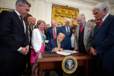 President Trump signing the Act